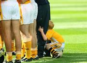 2 August 2008; Four year old James Gormley, son of Antrim manager Jody Gormley, peeps throught his fathers legs during the the team huddle before the game. Tommy Murphy Cup Final, Antrim v Wicklow, Croke Park, Dublin. Picture credit: Oliver McVeigh / SPORTSFILE