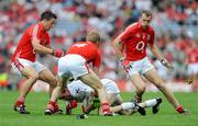 10 August 2008; John Doyle, Kildare, in action against Cork players, from left, Brian O'Regan, Anthony Lynch and Alan O'Connor. GAA Football All-Ireland Senior Championship Quarter-Final, Cork v Kildare, Croke Park, Dublin. Picture credit: Stephen McCarthy / SPORTSFILE