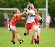 9 August 2008; Neamh Woods, Tyrone, in action against Grainne McAlinden, left, and Rhona O'Mahony, Armagh. TG4 All-Ireland Ladies Senior Football Championship Qualifier, Round 2, Tyrone v Armagh, Dromard GAA Club, Legga, Co. Longford. Picture credit: Matt Browne / SPORTSFILE