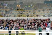 12 June 2015; Spectators do a 'Mexican Wave' during The Underwriting Exchange Ltd 'Jumping In The City' Series - Cork Leg. Curaheen Park Greyhound Stadium, Cork. Picture credit: Diarmuid Greene / SPORTSFILE