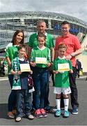 13 June 2015; Pictured, from left to right, are Seán Hickey, aged 8, from Ratoath, Co. Meath alongside his mum Anne-Marie, Taylor Lombard, aged 11, from Ardsallagh, Co. Waterford, with her father Anthony and Daniel Gill, aged 7, from Newbridge, Co. Kildare, alongside his dad Ken at the Aviva Stadium. Seán, Taylor and Daniel won a McDonald’s Future Football competition to become a flag bearer for the crucial Ireland v Scotland European Championship Qualifier at the Aviva Stadium. McDonald’s FAI Future Football is a programme designed to support grassroots football clubs by enriching the work they do at local level. Over 10,000 boys and girls from 165 football clubs in Ireland will take part this year, generating 70,000 additional hours of activity. UEFA EURO 2016 Championship Qualifier, Group D, Republic of Ireland v Scotland, Aviva Stadium, Lansdowne Road, Dublin. Picture credit: Ramsey Cardy / SPORTSFILE