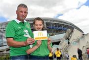 13 June 2015; Pictured is Taylor Lombard, aged 11, from Ardsallagh, Co. Waterford, with her father Anthony at the Aviva Stadium. Taylor won a McDonald’s Future Football competition to become a flag bearer for the crucial Ireland v Scotland European Championship Qualifier at the Aviva Stadium. McDonald’s FAI Future Football is a programme designed to support grassroots football clubs by enriching the work they do at local level. Over 10,000 boys and girls from 165 football clubs in Ireland will take part this year, generating 70,000 additional hours of activity. UEFA EURO 2016 Championship Qualifier, Group D, Republic of Ireland v Scotland, Aviva Stadium, Lansdowne Road, Dublin. Picture credit: Ramsey Cardy / SPORTSFILE