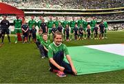 13 June 2015; Pictured is Taylor Lombard, aged 11, from Ardsallagh, Co.Waterford, during the pre-match ceremony. Taylor won a McDonald’s Future Football competition to become a flag bearer for the crucial Ireland v Scotland European Championship Qualifier at the Aviva Stadium. McDonald’s FAI Future Football is a programme designed to support grassroots football clubs by enriching the work they do at local level. Over 10,000 boys and girls from 165 football clubs in Ireland will take part this year, generating 70,000 additional hours of activity. UEFA EURO 2016 Championship Qualifier, Group D, Republic of Ireland v Scotland, Aviva Stadium, Lansdowne Road, Dublin. Picture credit: David Maher / SPORTSFILE