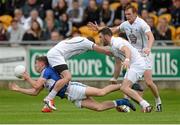 13 June 2015; Colm Begley, Laois, in action against Kildare players from left, Kevin Murnaghan, Fergal Conway and Paul Cribbin. Leinster GAA Football Senior Championship, Quarter-Final Replay Kildare v Laois. O'Connor Park, Tullamore, Co. Offaly. Picture credit: Piaras Ó Mídheach / SPORTSFILE