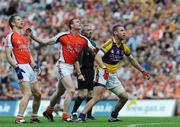 9 August 2008; Matty Forde, Wexford, watches his kick go over the bar alongisde Paul McGrane, left, and Kieran Toner, Armagh, and referee Paddy Russell, Tipperary. GAA Football All-Ireland Senior Championship Quarter-Final, Armagh v Wexford, Croke Park, Dublin. Picture credit: Stephen McCarthy / SPORTSFILE