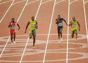 16 August 2008; Usain Bolt, of Jamaica, 2163, races clear of Richard Thompson, Trinidad and Tobago, 3025, and Darvis Patton, USA, on his way to victory in the Men's 100m Final in a world record time of 9.69 seconds. Beijing 2008 - Games of the XXIX Olympiad, National Stadium, Olympic Green, Beijing, China. Picture credit: Ray McManus / SPORTSFILE