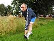 16 August 2008; Former Tipperary hurler John Leahy warms up before the start of the Lifestyle adidas Race Series - Frank Duffy 10 Mile Road Race. Phoenix Park, Dublin. Picture credit: Ray Lohan / SPORTSFILE  *** Local Caption ***