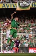 13 June 2015; James McCarthy, Republic of Ireland, challenges Russell Martin, Scotland, for which he received a yellow card. UEFA EURO 2016 Championship Qualifier, Group D, Republic of Ireland v Scotland, Aviva Stadium, Lansdowne Road, Dublin. Picture credit: David Maher / SPORTSFILE