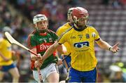 14 June 2015; Tomas Seale, Roscommon, in action against Kieran McDermott, Mayo. Christy Ring Cup Promotion / Relegation Play-Off, Mayo v Roscommon. Pearse Stadium, Galway. Picture credit: David Maher / SPORTSFILE