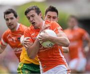14 June 2015; Ethan Rafferty, Armagh, in action against Martin O'Reilly, Donegal. Ulster GAA Football Senior Championship Quarter-Final, Armagh v Donegal. Athletic Grounds, Armagh. Picture credit: Brendan Moran / SPORTSFILE