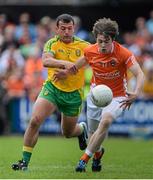 14 June 2015; Andrew Murnin, Armagh, in action against Frank McGlynn, Donegal. Ulster GAA Football Senior Championship Quarter-Final, Armagh v Donegal. Athletic Grounds, Armagh. Picture credit: Brendan Moran / SPORTSFILE