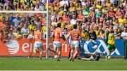 14 June 2015; Martin O'Reilly, Donegal, far left, scoring his side's second goal against Matthew McNiece, Armagh. Ulster GAA Football Senior Championship Quarter-Final, Armagh v Donegal. Athletic Grounds, Armagh. Picture credit: Oliver McVeigh / SPORTSFILE