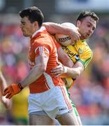 14 June 2015; Martin McElhinney, Donegal, in action against Caolan Rafferty, Armagh. Ulster GAA Football Senior Championship Quarter-Final, Armagh v Donegal. Athletic Grounds, Armagh. Picture credit: Brendan Moran / SPORTSFILE