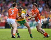 14 June 2015; Michael Murphy, Donegal, in action against Charlie Vernon, left, and Tony Kernan, Armagh. Ulster GAA Football Senior Championship Quarter-Final, Armagh v Donegal. Athletic Grounds, Armagh. Picture credit: Brendan Moran / SPORTSFILE