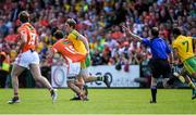14 June 2015; Referee David Coldrick signals advantage as Hugh McFadden, Donegal, pulls the jersey of Jamie Clarke, Armagh. Ulster GAA Football Senior Championship Quarter-Final, Armagh v Donegal. Athletic Grounds, Armagh. Picture credit: Brendan Moran / SPORTSFILE