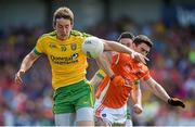 14 June 2015; Hugh McFadden, Donegal, in action against Caolan Rafferty, Armagh. Ulster GAA Football Senior Championship Quarter-Final, Armagh v Donegal. Athletic Grounds, Armagh. Picture credit: Brendan Moran / SPORTSFILE
