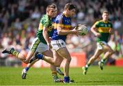 14 June 2015; Philip Austin, Tipperary, in action against Shane Enright, Kerry. Munster GAA Football Senior Championship Semi-Final, Kerry v Tipperary. Semple Stadium, Thurles, Co. Tipperary. Picture credit: Ray McManus / SPORTSFILE