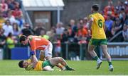 14 June 2015; Paddy McGrath, Donegal, and Jamie Clarke, Armagh, in a tussle during the game, from which both received yellow cards. Ulster GAA Football Senior Championship Quarter-Final, Armagh v Donegal. Athletic Grounds, Armagh. Picture credit: Brendan Moran / SPORTSFILE