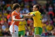 14 June 2015; Andrew Murnin, Armagh, and Neil McGee, Donegal, pulling at each others shirts. Ulster GAA Football Senior Championship Quarter-Final, Armagh v Donegal. Athletic Grounds, Armagh. Picture credit: Oliver McVeigh / SPORTSFILE