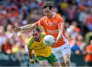 14 June 2015; Jamie Clarke, Armagh, in action against Karl Lacey, Donegal. Ulster GAA Football Senior Championship Quarter-Final, Armagh v Donegal. Athletic Grounds, Armagh. Picture credit: Oliver McVeigh / SPORTSFILE