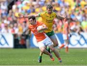 14 June 2015; Jamie Clarke, Armagh, in action against Christy Toye, Donegal. Ulster GAA Football Senior Championship Quarter-Final, Armagh v Donegal. Athletic Grounds, Armagh. Picture credit: Oliver McVeigh / SPORTSFILE