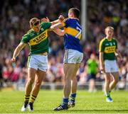 14 June 2015; Alan Campbell, Tipperary, jostels with Kerry substitute James O'Donoghue. Campbell was shown a yellow card after the referee consulted with his umpires. Munster GAA Football Senior Championship Semi-Final, Kerry v Tipperary. Semple Stadium, Thurles, Co. Tipperary. Picture credit: Ray McManus / SPORTSFILE
