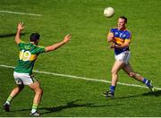 14 June 2015; Peter Acheson, Tipperary, plays a pass over Donagh Leahy, Kerry. Munster GAA Football Senior Championship Semi-Final, Kerry v Tipperary. Semple Stadium, Thurles, Co. Tipperary. Picture credit: Seb Daly / SPORTSFILE