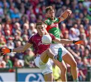 14 June 2015; Fiontan O'Curraroin, Galway, in action against Aidan O'Shea, Mayo. Connacht GAA Football Senior Championship Semi-Final, Galway v Mayo. Pearse Stadium, Galway. Picture credit: David Maher / SPORTSFILE