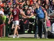 14 June 2015; Paul Conroy, Galway, shakes hands with manager Kevin Walsh after being shown the black card by referee Padraig Hughes. Connacht GAA Football Senior Championship Semi-Final, Galway v Mayo. Pearse Stadium, Galway. Picture credit: Piaras Ó Mídheach / SPORTSFILE