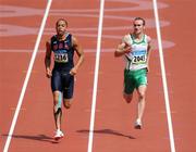 18 August 2008; Paul Hession, 2045, Ireland, looks across towards Wallace Spearmon, 3236, of the USA, during the Round 1 heats of the Men's 400m heats, where he finished 3rd in a time of 20.59 and progressed to Round 2. Beijing 2008 - Games of the XXIX Olympiad, National Stadium, Olympic Green, Beijing, China. Picture credit: Brendan Moran / SPORTSFILE