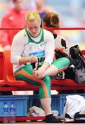 18 August 2008; Eileen O'Keeffe, Ireland, removes a bandage from her foot after Group B qualifying in the Women's Hammer. She threw a best of 67.66m but failed to qualify for the final. Beijing 2008 - Games of the XXIX Olympiad, National Stadium, Olympic Green, Beijing, China. Picture credit: Brendan Moran / SPORTSFILE