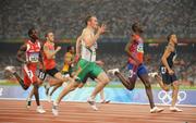 18 August 2008; Paul Hession, Ireland, on his way to winning his Round 2 heat of the Men's 200m, ahead of Wallace Spearmon, right, of the USA, and Jaysuma Saidy Ndure, centre, of Norway. He posted a season best time of 20.32 and qualified for the semi-finals. Beijing 2008 - Games of the XXIX Olympiad, National Stadium, Olympic Green, Beijing, China. Picture credit: Brendan Moran / SPORTSFILE