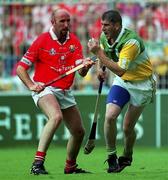 6 August 2000; Offaly's Michael Duignan in action against Cork's Brian Corcoran. Cork v Dublin, All-Ireland Minor Hurling semi-final, Croke Park, Dublin. Picture credit; Ray McManus/SPORTSFILE