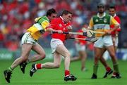 6 August 2000; Cork's Michael O'Connell gets away from Offaly's Johnny Pilkington. Offaly v Cork, All-Ireland Hurling semi-final, Croke Park, Dublin. PIcture credit; Ray McManus/SPORTSFILE