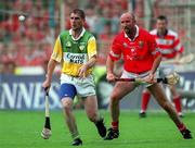 6 August 2000; Michael Duignan, Offaly, in action against Brian Corcoran, Cork. Offaly v Cork, All-Ireland Senior Hurling Championship Semi Final, Croke Park, Dublin. Picture credit; Ray McManus/SPORTSFILE