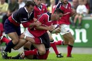 12 August 2000; Jeremy Staunton, Munster, is tackled by Gloucester Ian Sanders, left, and Jacke Boer. Munster v Gloucester, Rugby, Thomand Park, Limerick. Picture credit; Matt Browne/SPORTSFILE *EDI*