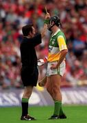 6 August 2000; Referee Willie Barrett books Offaly's Gary Hannify. Offaly v Cork, All-Ireland Senior Hurling Semi- Final replay, Croke Park, Dublin. Picture credit; Ray McManus/SPORTSFILE