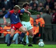 Ray HOUGHTON Ireland and Christoph FRICK Liechtenstein 21/5/97 Lansdowne Road Soccer. Photograph Brendan Moran  / SPORTSFILE
