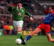 Rep of Ireland's Mark Kennedy in a tussle for possession with  Liechtenstein's Patrick Hefti  at Lansdowne Rd. 21/5/97. Soccer. Photograph: David Maher SPORTSFILE.