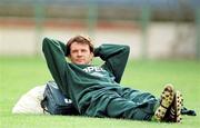 Rep of Ireland's Ray Houghton relaxes during an Irish squad training session in the Steuea Stadium, Bucharest. 29/4/97.Photograph: Ray McManus SPORTSFILE.