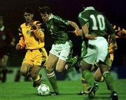 Rep of Ireland's Kevin KILBANE races past Romania's Marius BACIU and Iulian MIU (Ireland 10 is Neale FENN) during their U-21 match at the National Stadium, Bucharest. Soccer. 29/4/97. Photograph: David Maher SPORTSFILE.