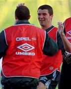 Roy Keane, centre, shares a joke with Terry Phelan and Alan Kelly, right. during a training session in the Controceni Stadium in Bucharest, Romania. Soccer. Mon 28/4/97. Photograph: David Maher SPORTSFILE.