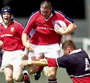 12 August 2000; Peter Bracken, Munster, evades his tackle by Gloucester's second-row Rob Fidler. Munster v Gloucester, Thomond Park, Limerick. Rugby. Picture credit; Matt Browne/SPORTSFILE*EDI*