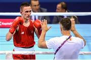 16 June 2015; Myles Casey, Ireland, celebrates with coach Billy Walsh after defeating Ivan Fihurenka, Belarus, during their Men's Fly 52kg Round of 32 bout. 2015 European Games, Crystal Hall, Baku, Azerbaijan. Picture credit: Stephen McCarthy / SPORTSFILE