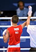 16 June 2015; Muhammad Ali, Great Britain, is declared victorious over Alexandr Riscan, Moldova, during their Men's Boxing Fly 52kg Round of 32 bout. 2015 European Games, Crystal Hall, Baku, Azerbaijan. Picture credit: Stephen McCarthy / SPORTSFILE