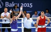 16 June 2015; Darren O'Neill, Ireland, is announced victorious over Ionut Jitaru, Romania, during their Men's Boxing Heavy 91kg Round of 32 bout. 2015 European Games, Crystal Hall, Baku, Azerbaijan. Picture credit: Stephen McCarthy / SPORTSFILE
