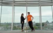 16 June 2015; Dublin football star Michael Darragh MacAuley with Lisa Comerford, Director of Brand and Communications, eircom, before they joined eircom’s GAA ambassadors Tomás O’Sé, Ciaran Whelan, David Brady and Brendan Devenney in eircom’s head office in Dublin to launch their online platform for supporters of this summer’s GAA Football All-Ireland Senior Championship. The GAA hub, www.eircom.ie/gaa, will see the introduction of a new feature where fans can record and share their views on players throughout the championship via a new audio social network BOAST and be in with a chance to win tickets to the All-Ireland Senior Football Final. #shoutitout. eircom Head Office, HSQ, Dublin. Picture credit: Brendan Moran / SPORTSFILE