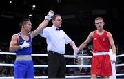 16 June 2015; Nazirov Bakhtovar, Russia, is announced victorious over Kurt Walker, Ireland, by referee Geir Dahlen following their Men's Boxing Bantam 56kg Round of 32 bout. 2015 European Games, Crystal Hall, Baku, Azerbaijan. Picture credit: Stephen McCarthy / SPORTSFILE