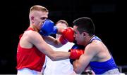 16 June 2015; Kurt Walker, Ireland, left, exchanges punches with Nazirov Bakhtovar, Russia, during their Men's Boxing Bantam 56kg Round of 32 bout. 2015 European Games, Crystal Hall, Baku, Azerbaijan. Picture credit: Stephen McCarthy / SPORTSFILE