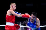 16 June 2015; Kurt Walker, Ireland, left, exchanges punches with Nazirov Bakhtovar, Russia, during their Men's Boxing Bantam 56kg Round of 32 bout. 2015 European Games, Crystal Hall, Baku, Azerbaijan. Picture credit: Stephen McCarthy / SPORTSFILE